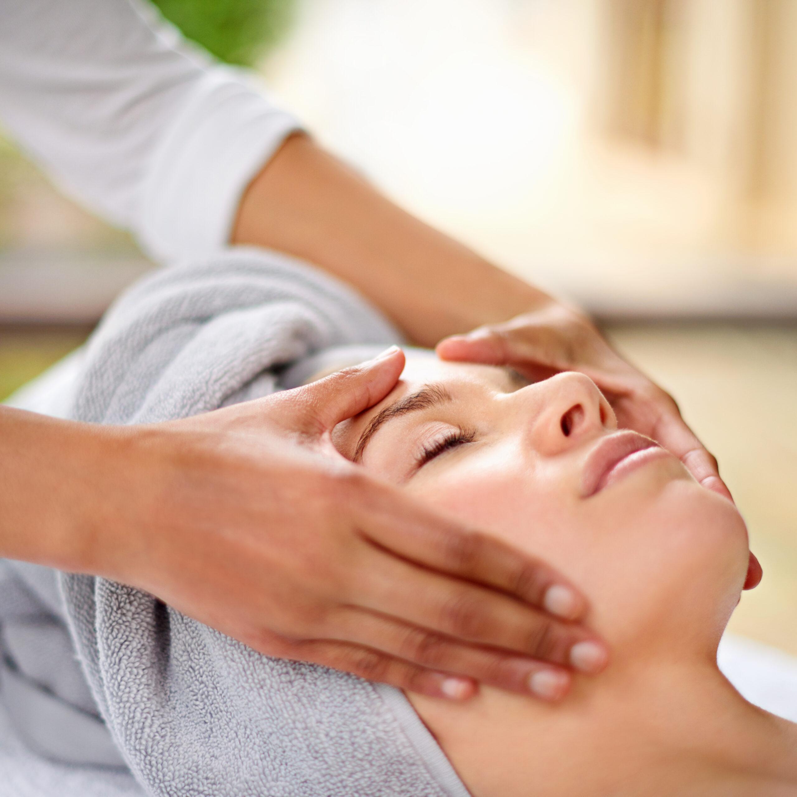 Cropped shot of a young woman enjyoing a massage at the day spa.